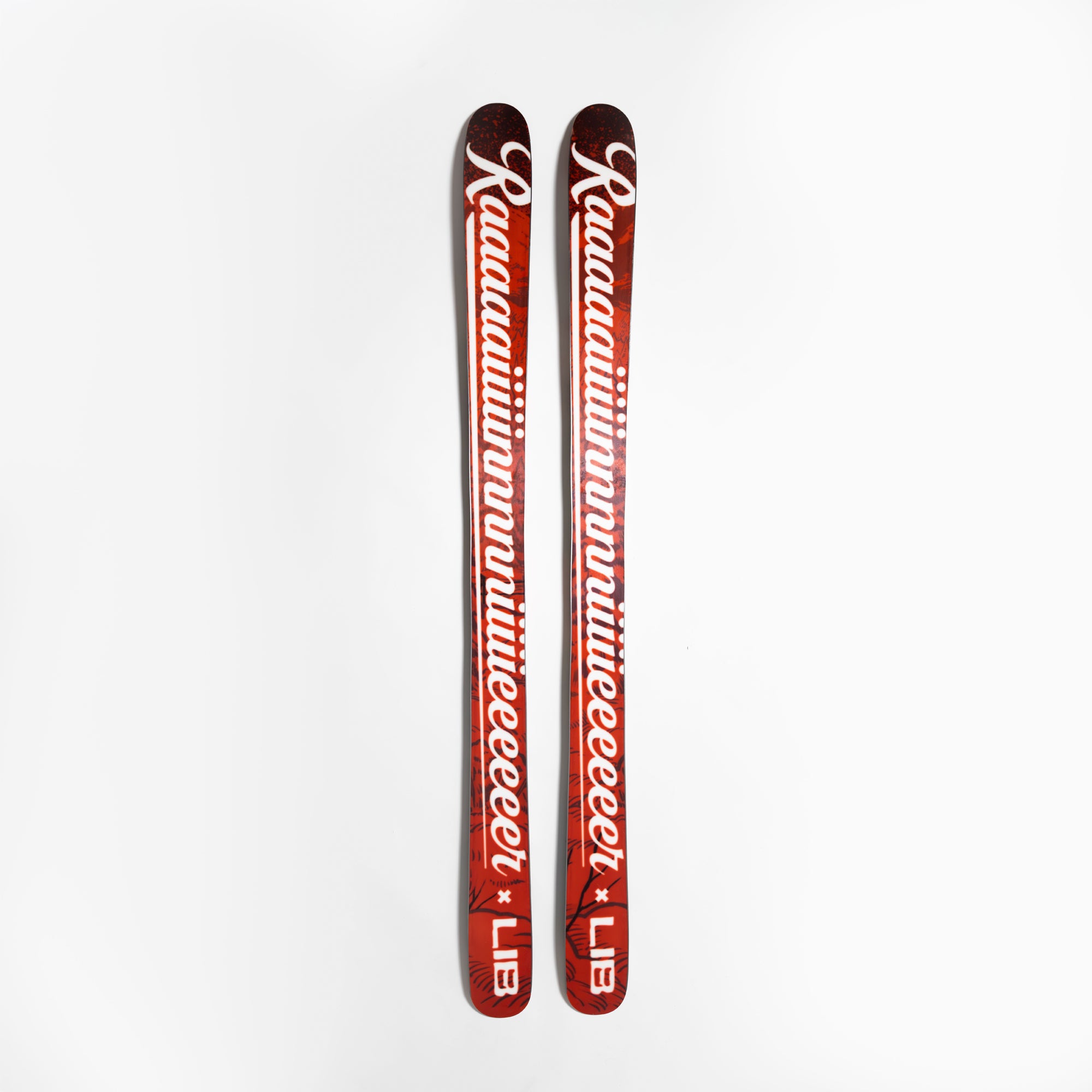 Two red skis with Rainer x LIB
